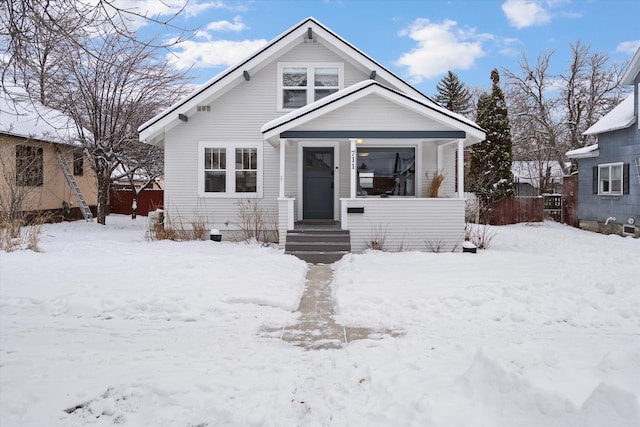 bungalow-style home featuring fence