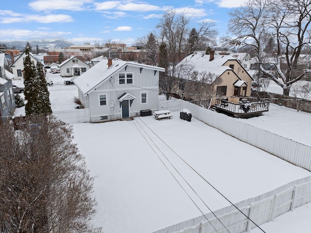 snowy aerial view featuring a residential view