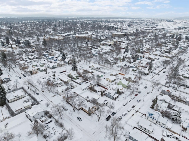 snowy aerial view with a residential view