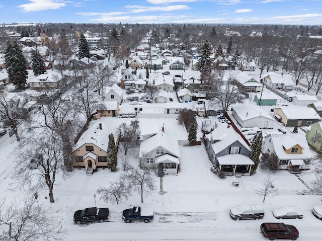 snowy aerial view featuring a residential view