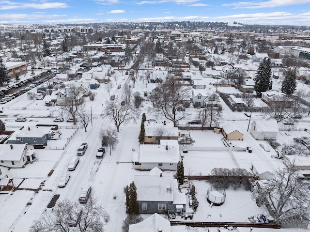 snowy aerial view with a residential view