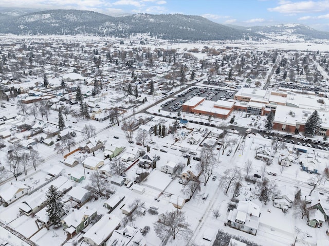 snowy aerial view with a mountain view