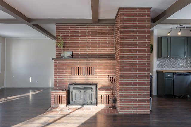 unfurnished living room featuring a wood stove, beamed ceiling, and dark hardwood / wood-style floors