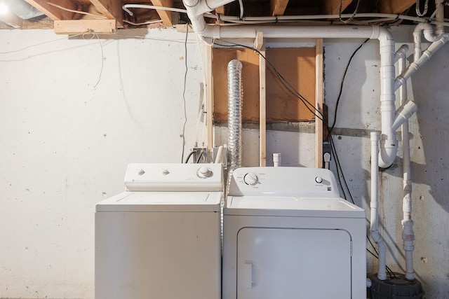 clothes washing area featuring washer and dryer