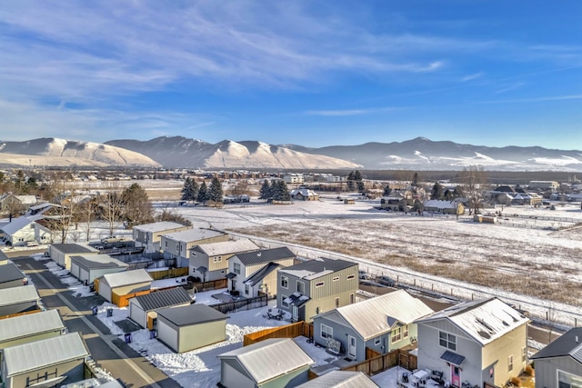 snowy aerial view featuring a mountain view