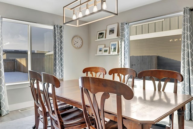 dining room with light wood-type flooring