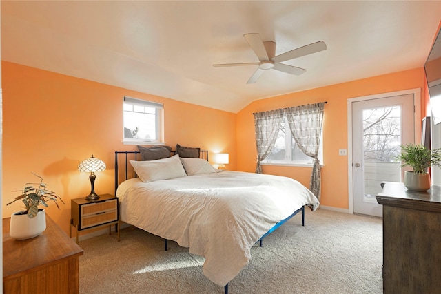 bedroom featuring carpet, ceiling fan, multiple windows, access to exterior, and lofted ceiling