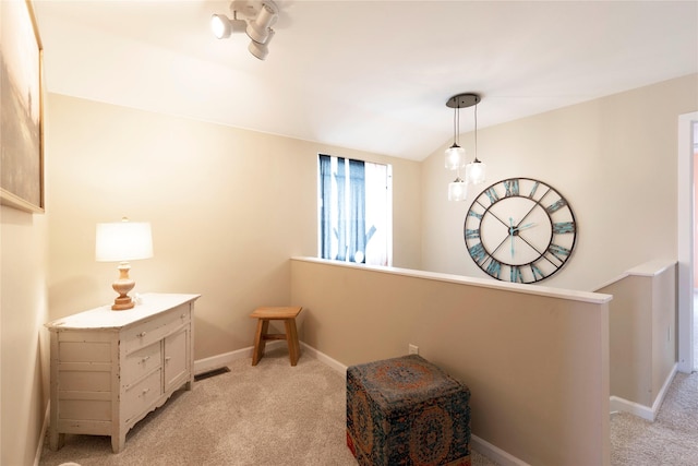 living area with light carpet and lofted ceiling