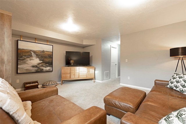 carpeted living room featuring a textured ceiling