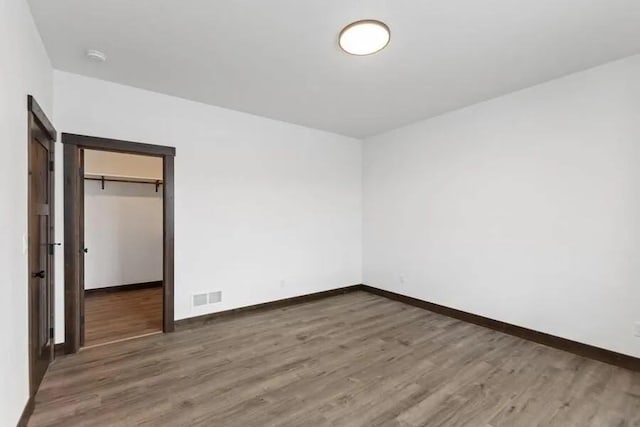 empty room featuring dark wood-type flooring