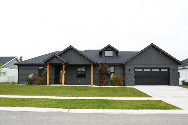 modern farmhouse style home with a garage and a front lawn