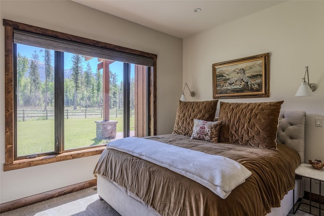190 Black Bear Ln, Bigfork, MT 59911 - carpeted bedroom featuring multiple windows