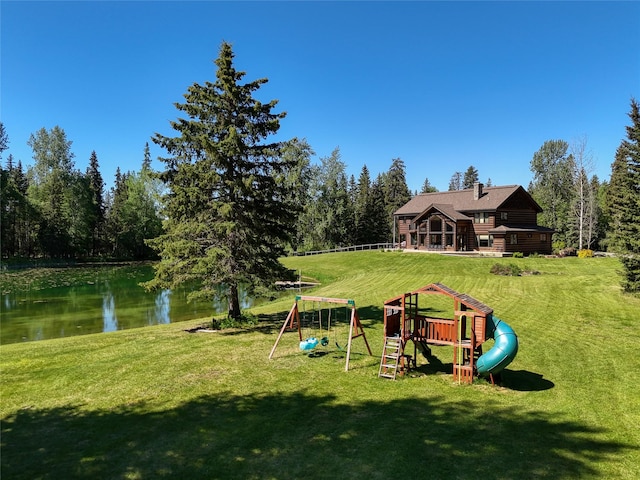 190 Black Bear Ln, Bigfork, MT 59911 - view of play area with a water view and a lawn