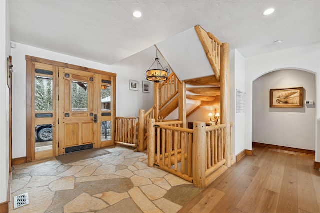 190 Black Bear Ln, Bigfork, MT 59911 - foyer entrance with baseboards, recessed lighting, light wood-style flooring, and stairway