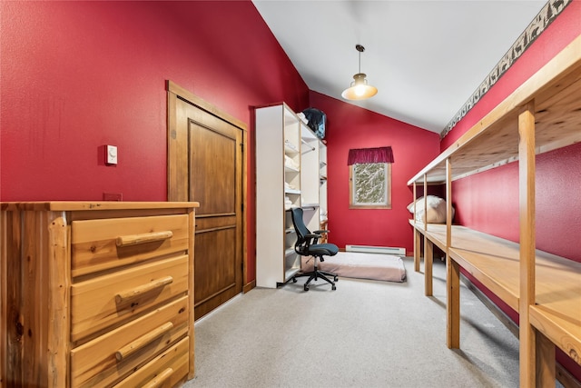 carpeted office with a baseboard heating unit and lofted ceiling