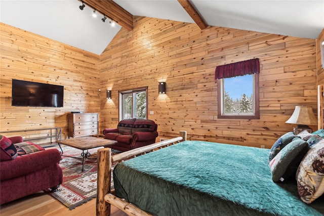 190 Black Bear Ln, Bigfork, MT 59911 - bedroom with wood walls, wood finished floors, and rail lighting