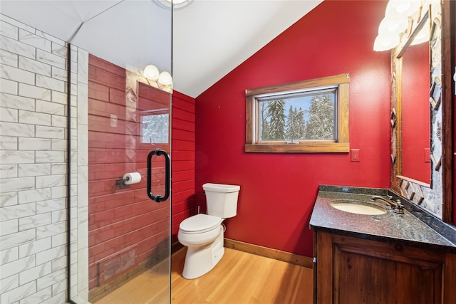 bathroom with lofted ceiling, vanity, toilet, hardwood / wood-style flooring, and an enclosed shower