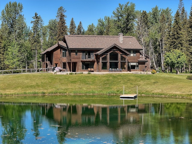 190 Black Bear Ln, Bigfork, MT 59911 - back of house featuring a water view and roof with shingles