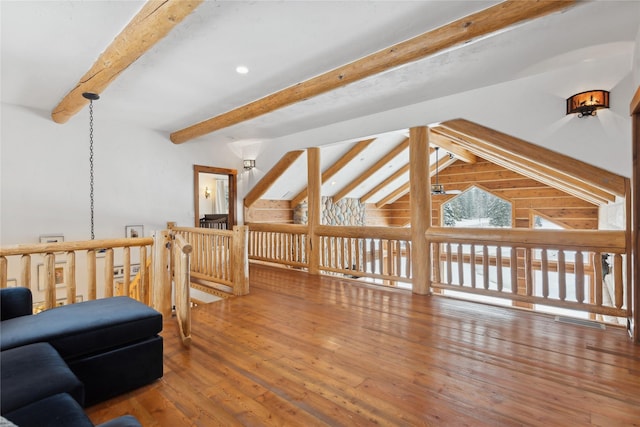 interior space featuring vaulted ceiling with beams and wood-type flooring