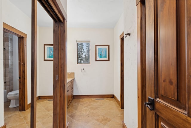 full bathroom featuring washtub / shower combination, toilet, and vanity