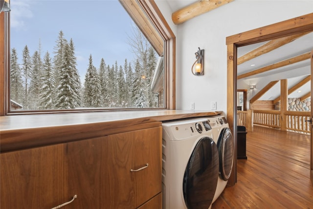 clothes washing area with separate washer and dryer and hardwood / wood-style flooring