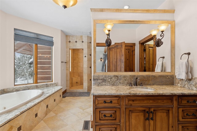 bathroom featuring vanity and plus walk in shower