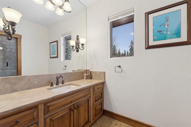 190 Black Bear Ln, Bigfork, MT 59911 - full bath featuring a chandelier, vanity, tile patterned floors, and baseboards