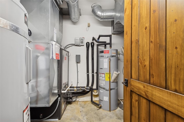 utility room featuring heating unit and strapped water heater