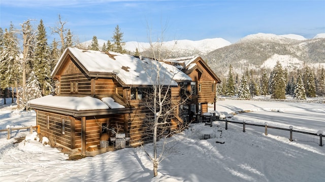 view of snowy exterior with a mountain view