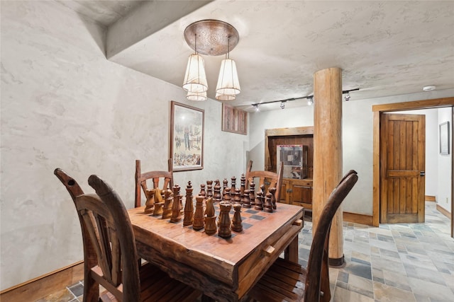 190 Black Bear Ln, Bigfork, MT 59911 - dining space featuring stone finish flooring and rail lighting