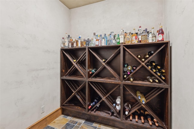 190 Black Bear Ln, Bigfork, MT 59911 - wine cellar with baseboards and stone finish floors