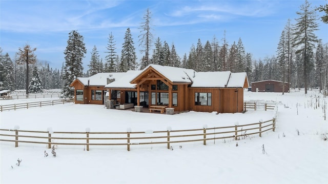 view of snow covered house