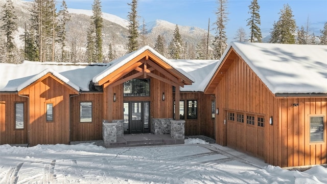 view of front of house with a mountain view and a garage