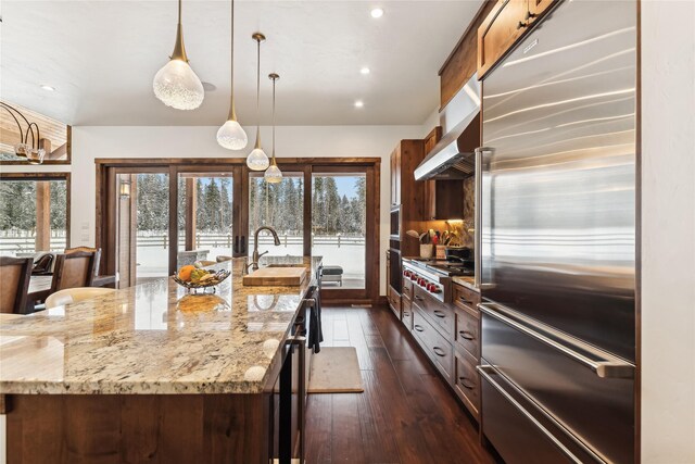 190 Black Bear Ln, Bigfork, MT 59911 - kitchen with stainless steel appliances, a sink, healthy amount of natural light, dark wood-type flooring, and recessed lighting