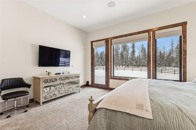 bedroom with light colored carpet and access to outside