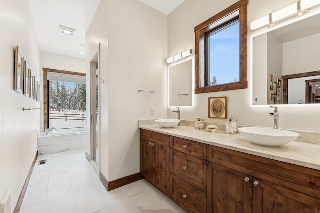 bathroom featuring separate shower and tub and vanity