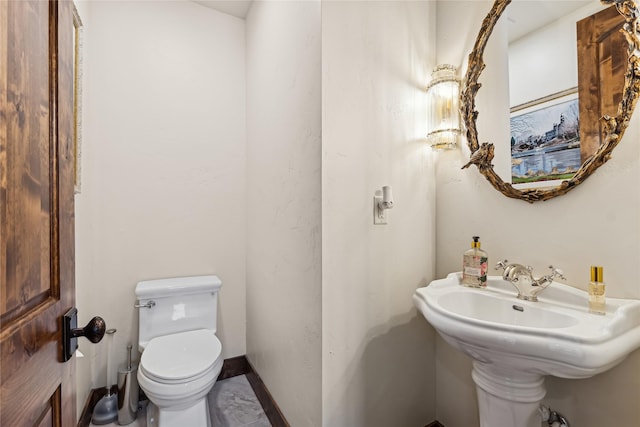 bathroom featuring toilet