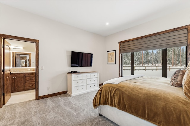 carpeted bedroom with ensuite bathroom