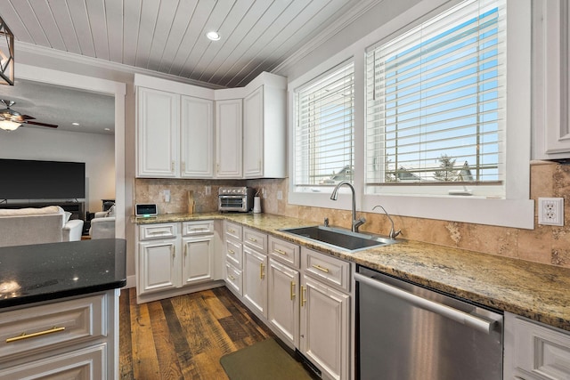 kitchen featuring sink, crown molding, stainless steel dishwasher, and white cabinetry