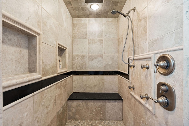 bathroom featuring tiled shower