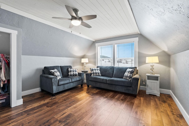 living room with a textured ceiling, dark wood-type flooring, lofted ceiling, and ceiling fan