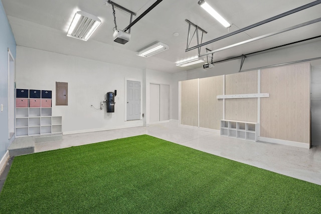 garage featuring a garage door opener, electric panel, and a lawn