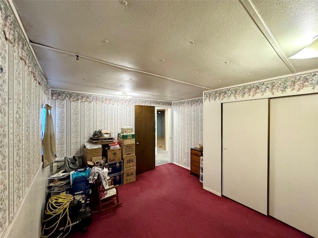 interior space with dark carpet and a textured ceiling