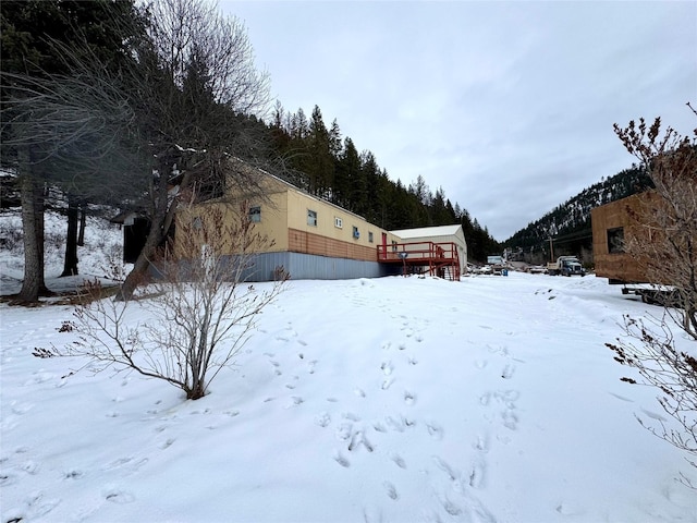 view of yard layered in snow