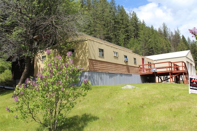 view of yard with a wooden deck