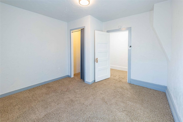 unfurnished bedroom featuring carpet floors