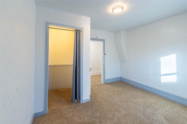 interior space featuring a closet and carpet