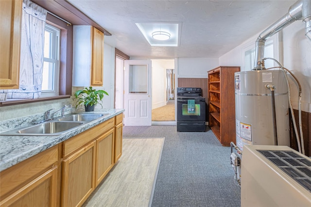 kitchen featuring light colored carpet, black electric range, sink, water heater, and light stone countertops