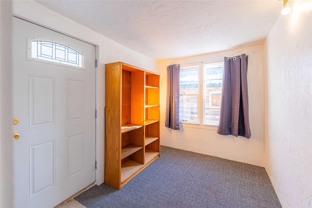 interior space with a healthy amount of sunlight and a textured ceiling