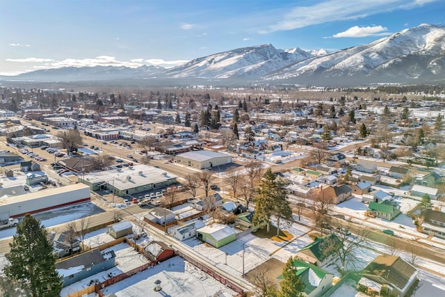 snowy aerial view with a mountain view